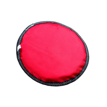 Load image into Gallery viewer, Back of neoprene soft frisbee toy (red with black edging). On white background.
