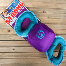 Load image into Gallery viewer, Chompter Chew and Tug Toy for dogs. Stuffed toy with purple stuffed round center and blue handles on either side. Displayed on wooden table with tag card attached. Say Big! Durable! Strong. .