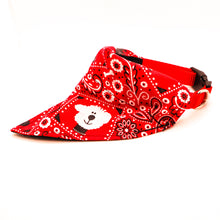 Load image into Gallery viewer, Side view of Classic red bandana print over-the-collar bandana put on a dog collar. Has classic bandana pattern with black and white dogs and white bones. Displayed on a white background.