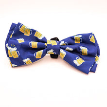 Load image into Gallery viewer, Picture of Bow Tie for pet collars with beer stein images on fabric. Shows edges of velcro used to attach bow tie to collar. Bow tie is navy blue with yellow and white beer images.