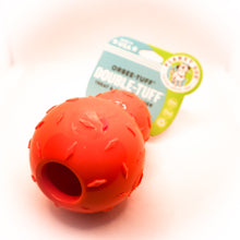 Load image into Gallery viewer, Angled bottom view of Diamond Plate Double-Tuff dog chew toy. Shows open hole in bottom for treats. Toy is orange with two attached balls (looks like a snowman). Ball has texture and is connected to card tag. Displayed on white background.