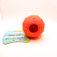 Load image into Gallery viewer, Full bottom view of Diamond Plate Double-Tuff dog chew toy. Shows open hole in bottom for treats. Toy is orange with two attached balls (looks like a snowman). Ball has texture and is connected to card tag. Displayed on white background.