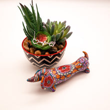 Load image into Gallery viewer, Silver necklace with open heart, heartbeat rhythm, and open pet paw. Displayed on succulent plant with a cute mosaic dachsund figurine.