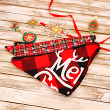 Load image into Gallery viewer, Picture of two Christmas pet bandanas. Bandana 1 (front in picture) has a red and black buffalo plaid check pattern with Merry Christmas printed on it. Bandana 2 has a red and black check pattern with yellow stripes and white snowflake images superimposed. Displayed on wooden board with red ribbon and Christmas ornament cut-outs.