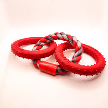 Load image into Gallery viewer, Side view picture of Dogzilla Lockin' Links dog toy. Toy has two hard red rubber rings connected by a twisted red/light gray/dark gray rope ring. Both hard rubber rings have raised nubs for texture. Displayed on a white background.
