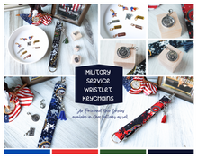Load image into Gallery viewer, Compilation picture of the Honor Your Military Veteran Charmable Wristlet Keychain collection. Includes pictures of Army, Navy and Marine keychains and charms.