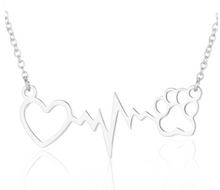 Load image into Gallery viewer, Silver necklace with open heart, heartbeat rhythm, and open pet paw.