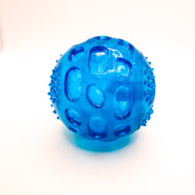 Load image into Gallery viewer, Picture of blue clear thermoplastic textured ball with squeaker.  Displayed on white background. 
