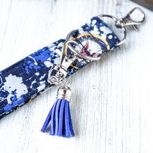 Load image into Gallery viewer, closeup picture of a Navy Charmable Wristlet keychain with blue tassel. 
